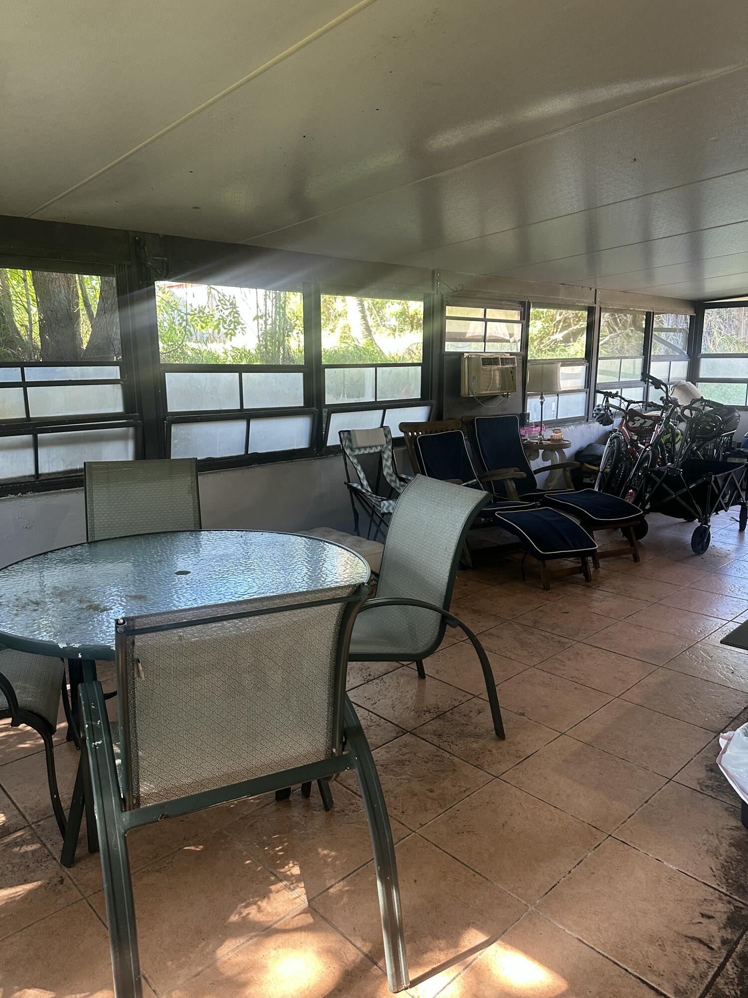 8812 Southeast Sandridge Avenue Hobe Sound, FL 33455 - Photo 18 of 22 a outdoor space with furniture