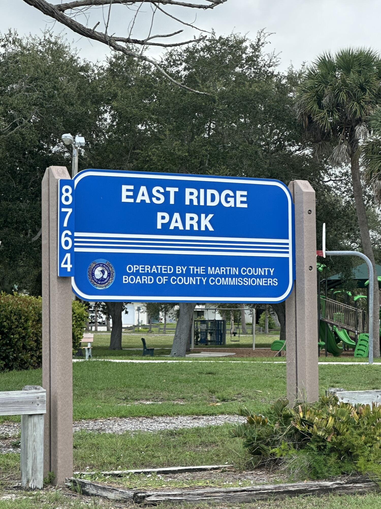 8812 Southeast Sandridge Avenue Hobe Sound, FL 33455 - Photo 21 of 22 a sign on the side of a building