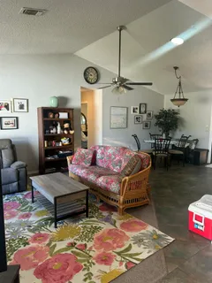 a living room with furniture and a table