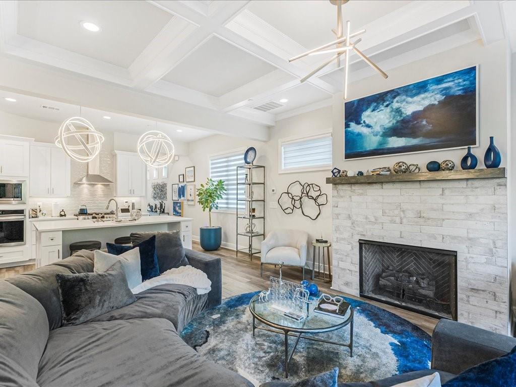 120 Via Roma Woodstock, GA 30188 - Photo 14 of 46 a living room with furniture a fireplace and a flat screen tv