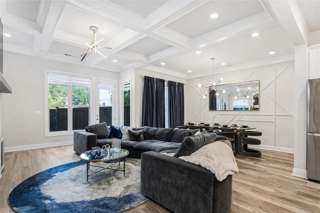 120 Via Roma Woodstock, GA 30188 - Photo 16 of 46 a living room with furniture and a large window