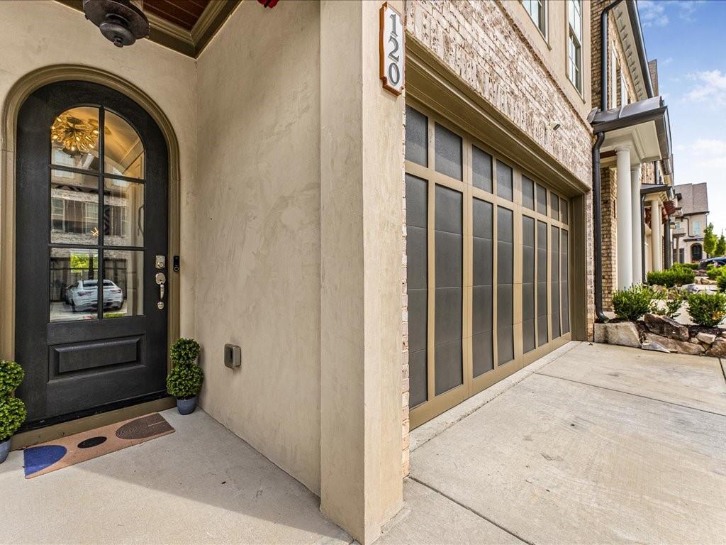 120 Via Roma Woodstock, GA 30188 - Photo 2 of 46 a view of entrance gate of a house