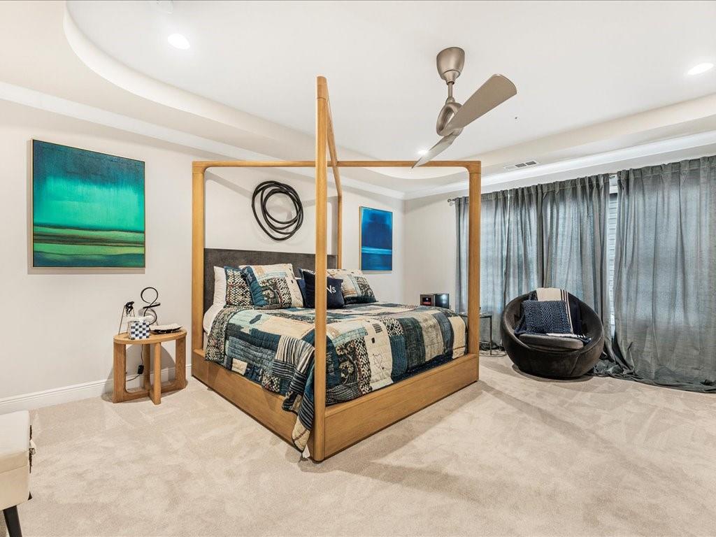 120 Via Roma Woodstock, GA 30188 - Photo 22 of 46 a bedroom with a bed and a chair