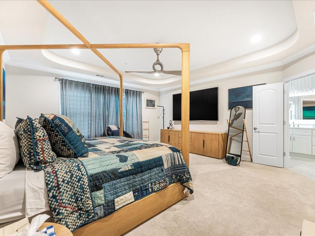 120 Via Roma Woodstock, GA 30188 - Photo 23 of 46 a living room with furniture a flat screen tv and a walk in closet