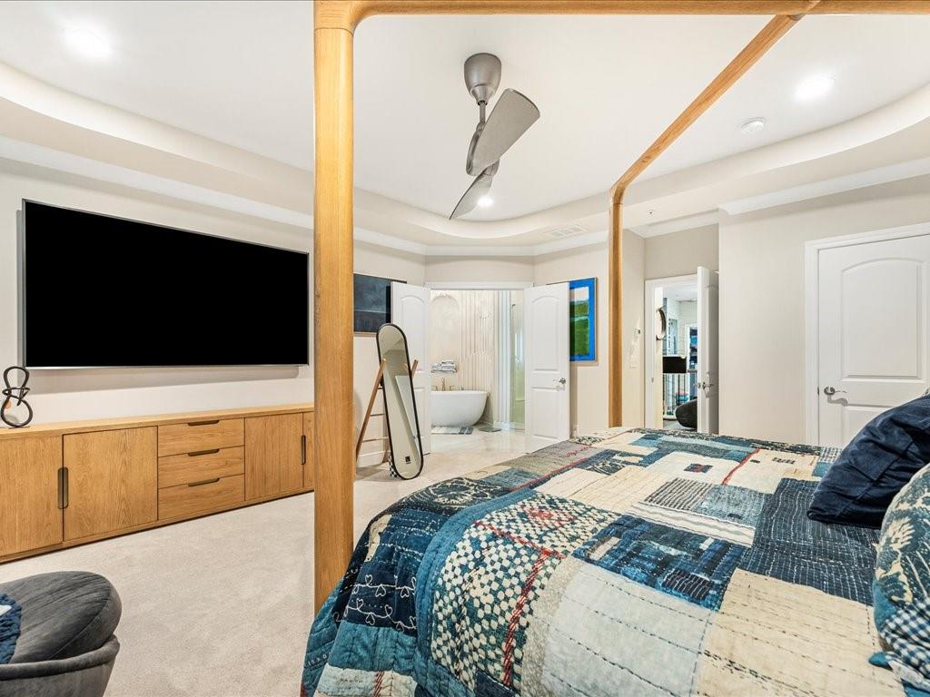 120 Via Roma Woodstock, GA 30188 - Photo 25 of 46 a bedroom with a bed and a flat screen tv