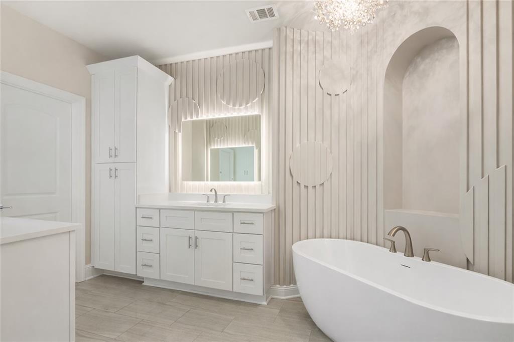 120 Via Roma Woodstock, GA 30188 - Photo 28 of 46 a spacious bathroom with a bathtub sink and mirror