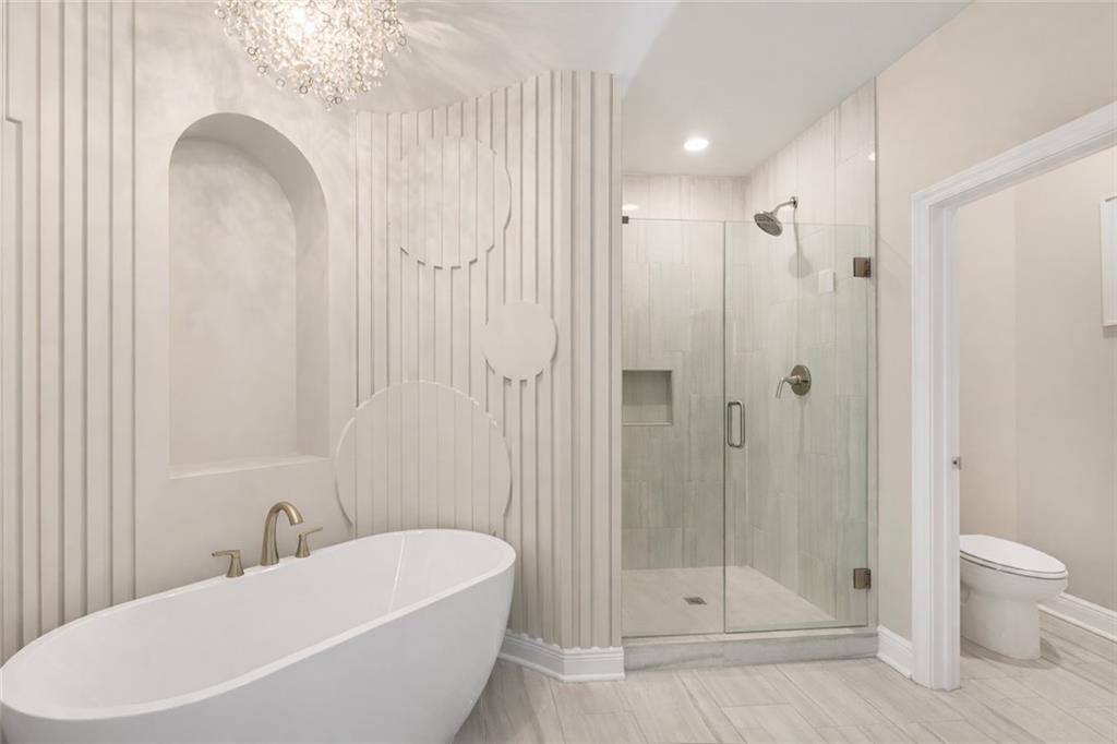 120 Via Roma Woodstock, GA 30188 - Photo 29 of 46 a bathroom with a bathtub and a shower