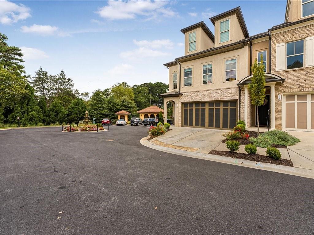 120 Via Roma Woodstock, GA 30188 - Photo 37 of 46 a view of multiple houses with a street
