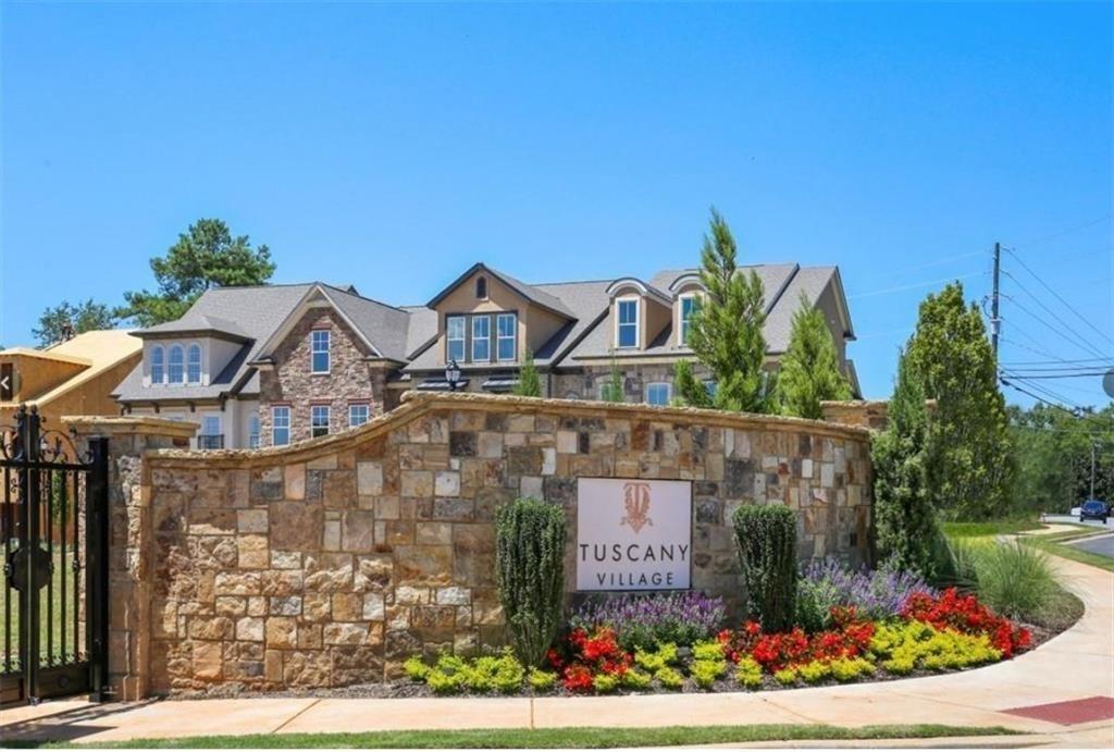120 Via Roma Woodstock, GA 30188 - Photo 41 of 46 a front view of a house with a garden