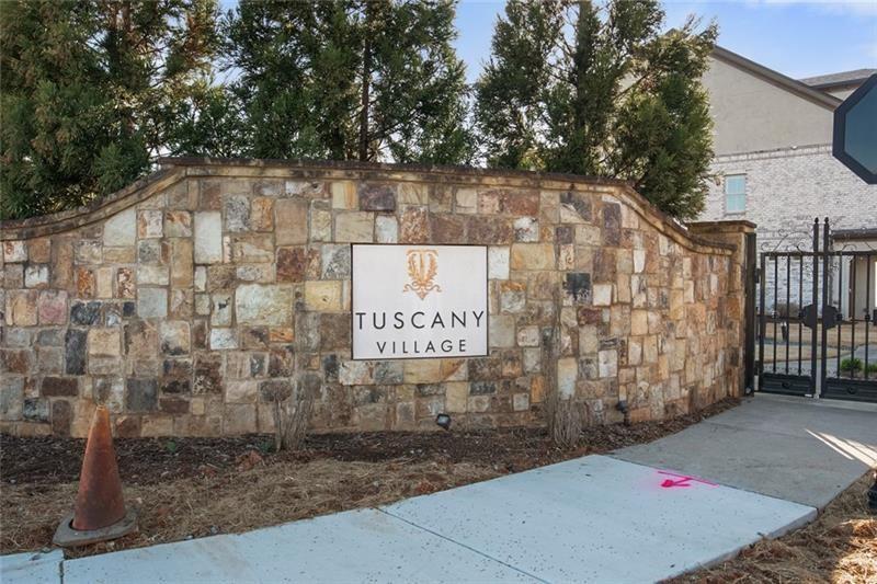 120 Via Roma Woodstock, GA 30188 - Photo 45 of 46 a sign that is on the side of the road