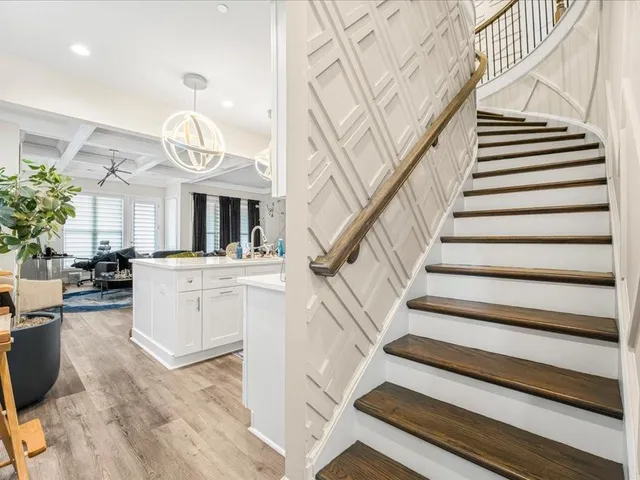 a kitchen with stove a sink and refrigerator