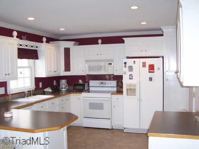 511 West Lebanon Road Mebane, NC 27302 - Photo 3 of 8 Other. Bright Kitchen w/ Recessed Lighting,Breakfast Bar & Built-in China Cabinet
