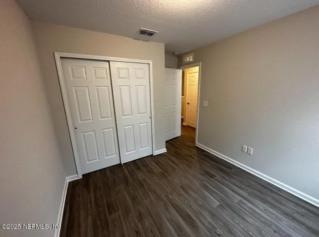 a view of a livingroom with wooden floor