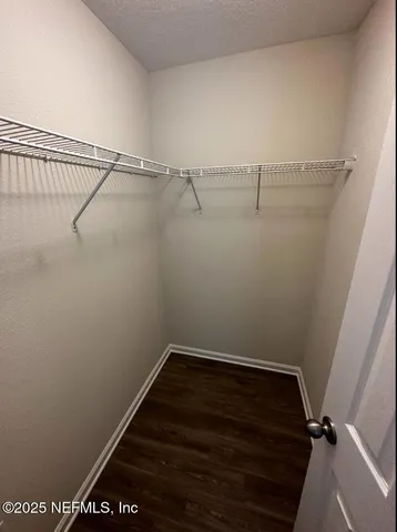 a view of a room with racks on the wall