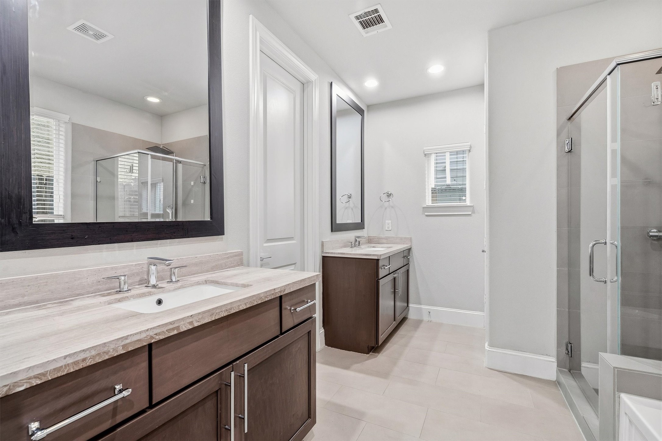 9614 Riddlewood Lane Houston, TX 77025 - Photo 10 of 23 a bathroom with a sink double vanity and a mirror