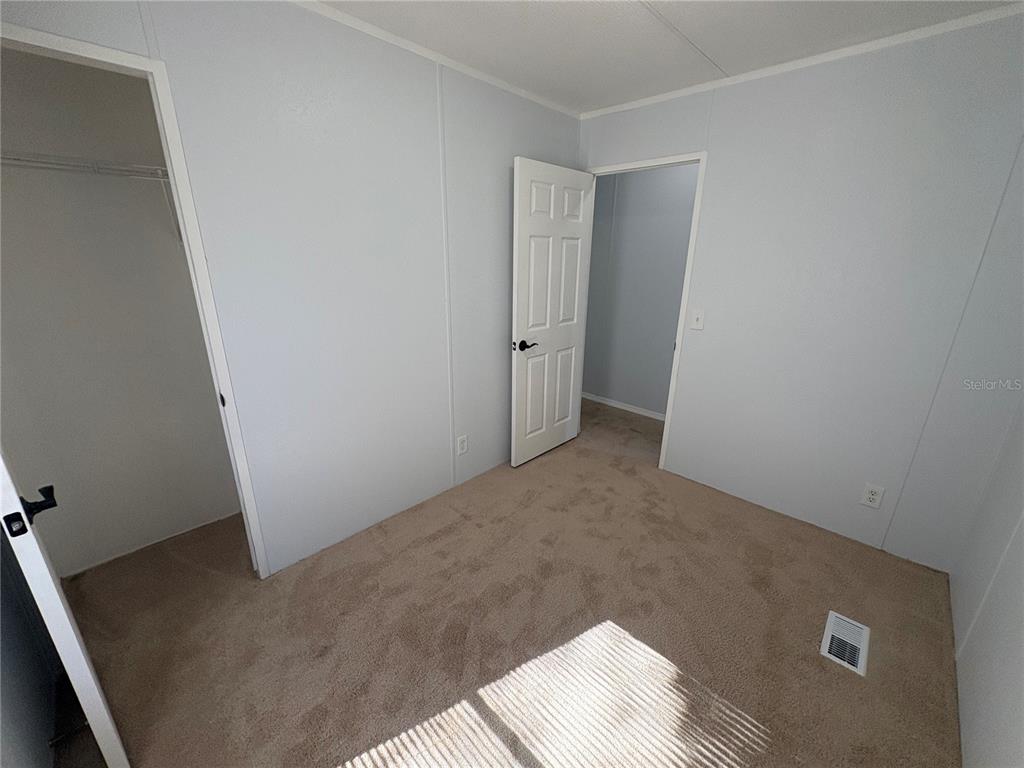 8939 Beverly Hills Road Lakeland, FL 33809 - Photo 13 of 23 an empty room with an empty space