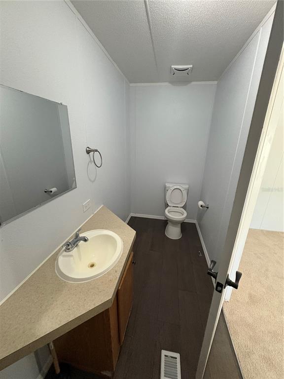 8939 Beverly Hills Road Lakeland, FL 33809 - Photo 20 of 23 a bathroom with a sink toilet and a mirror