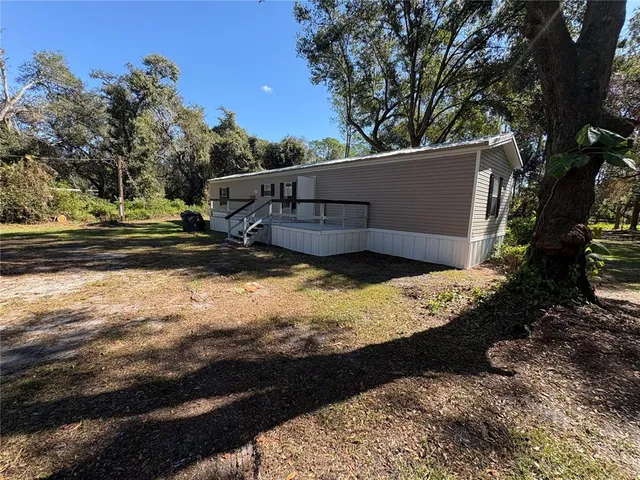 a view of a backyard of the house