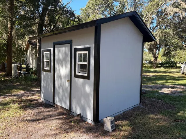 a view of a house with backyard space
