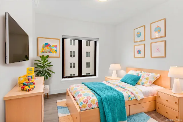 a bedroom with a bed and a couch