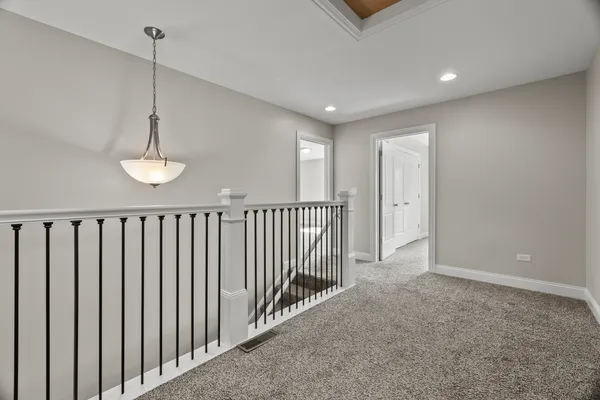 a view of a hallway with windows
