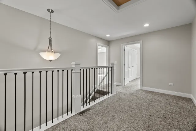 a view of a hallway with windows