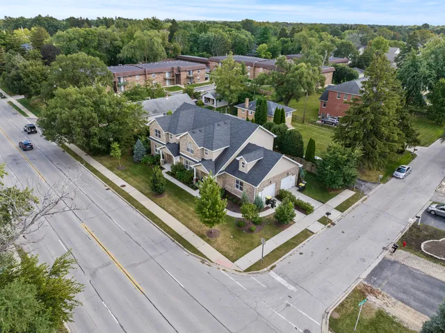 an aerial view of a house with a garden