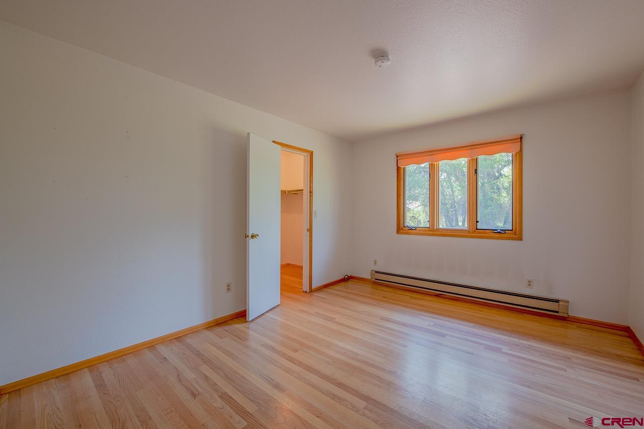 171 Arapahoe Road Gunnison, CO 81230 - Photo 17 of 34 Walk-in closet, hardwood floors.