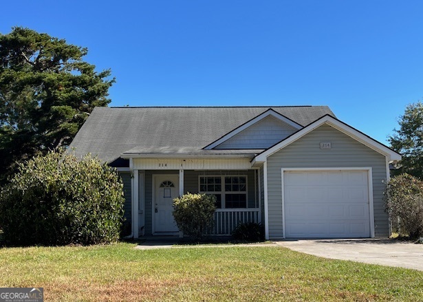 a view of house with backyard and glass windows