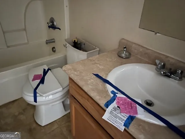 a bathroom with a sink and toilet