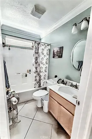 a bathroom with a sink mirror toilet and bathtub