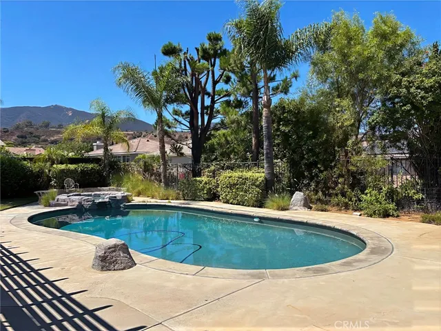a view of a swimming pool with a lounge chairs