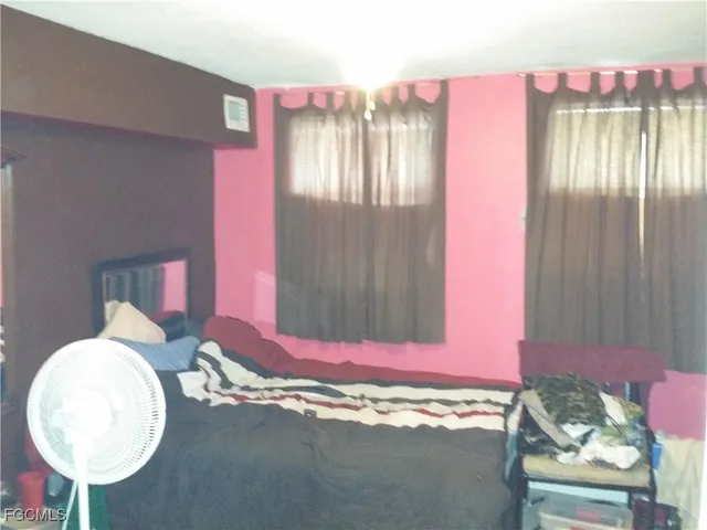 a bathroom with a sink mirror and vanity