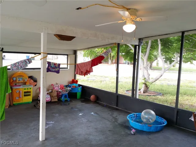 a room with furniture and a large window