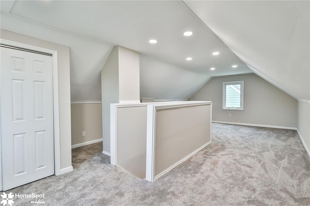 415 Willow Road Hellertown, PA 18055 - Photo 19 of 25 A versatile bonus space awaits, offering recessed lighting and soft carpeting under vaulted ceilings.