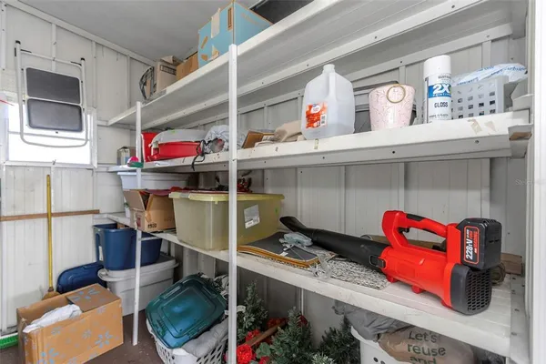 a view of a house with wooden fence