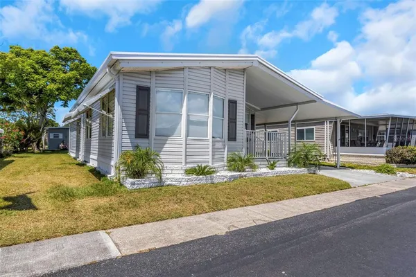 an aerial view of residential houses with city view