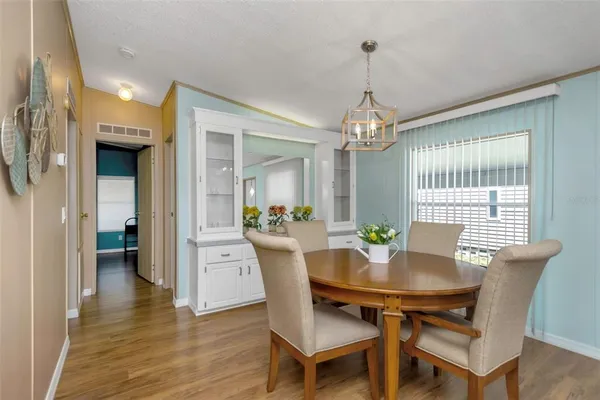 a dining room with furniture and window