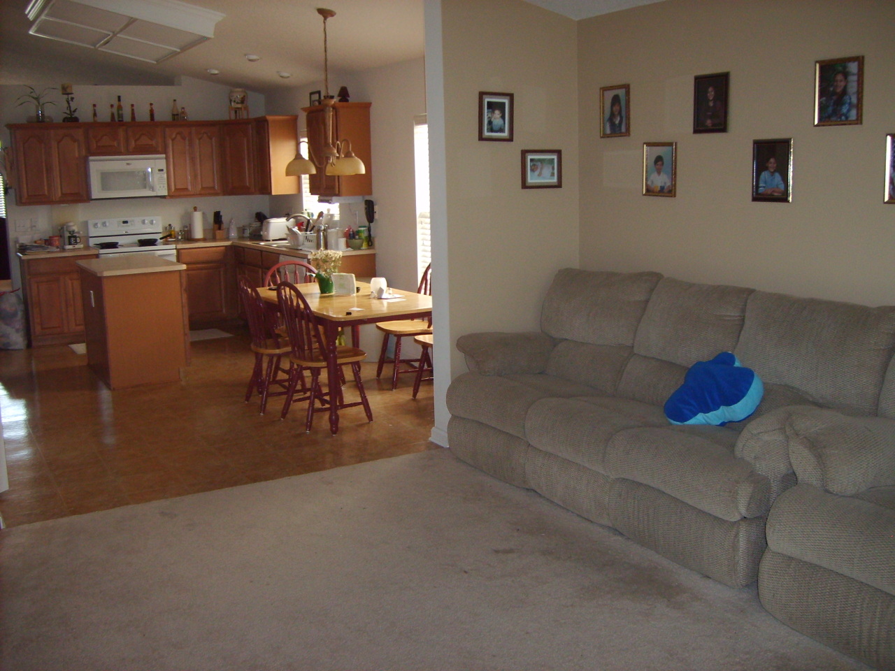 817 Crystal Spring Way St. Augustine, FL 32092 - Photo 3 of 4 a living room with furniture and a dining table with kitchen view