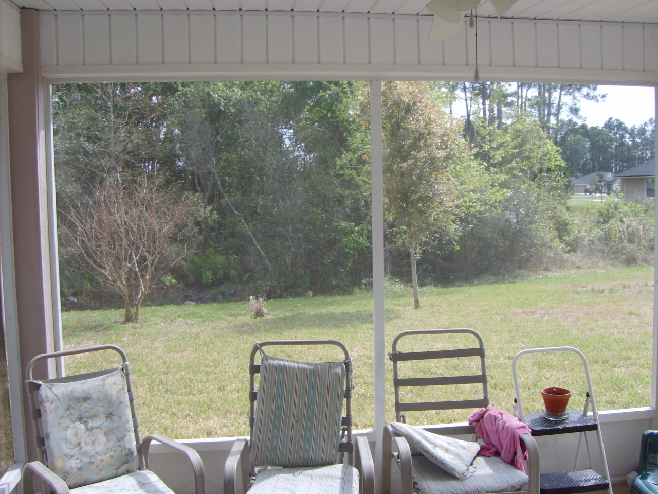 817 Crystal Spring Way St. Augustine, FL 32092 - Photo 4 of 4 a view of a porch with furniture and a yard