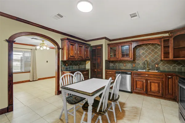 a kitchen with stainless steel appliances granite countertop a stove and a sink