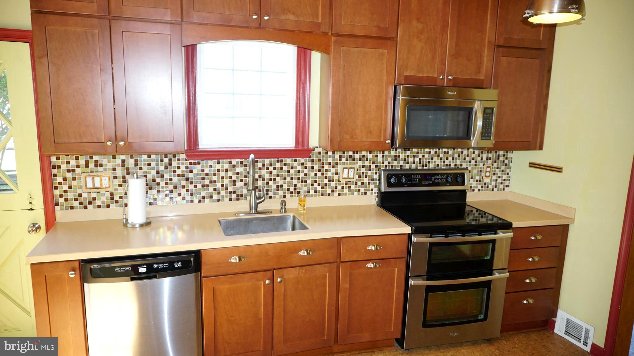 8237 Highpoint Road Clearwater Beach, MD 21226 - Photo 6 of 50 Nice tile backsplash setting off high end kitchen