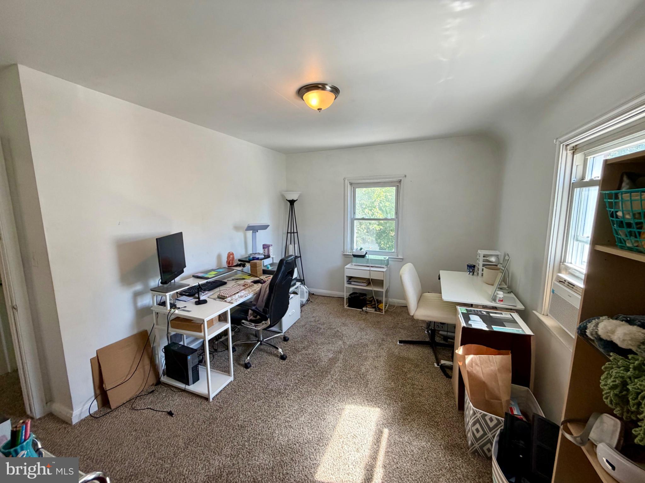 601 Braeside Road Baltimore, MD 21229 - Photo 8 of 19 a work room with furniture and a window