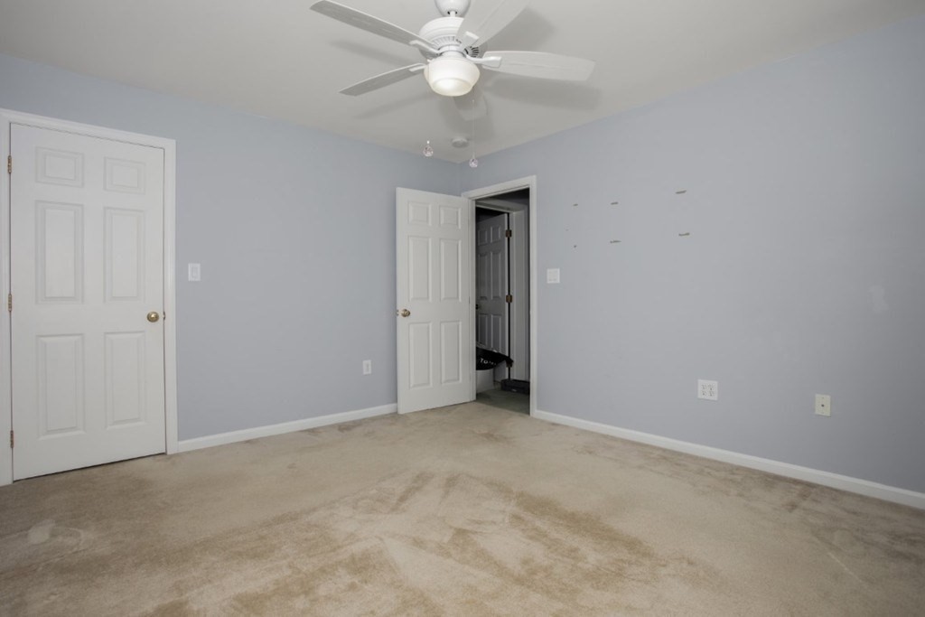 3 Bancroft Avenue, Unit 3 Reading, MA 01867 - Photo 13 of 19 a view of an empty room with a ceiling fan
