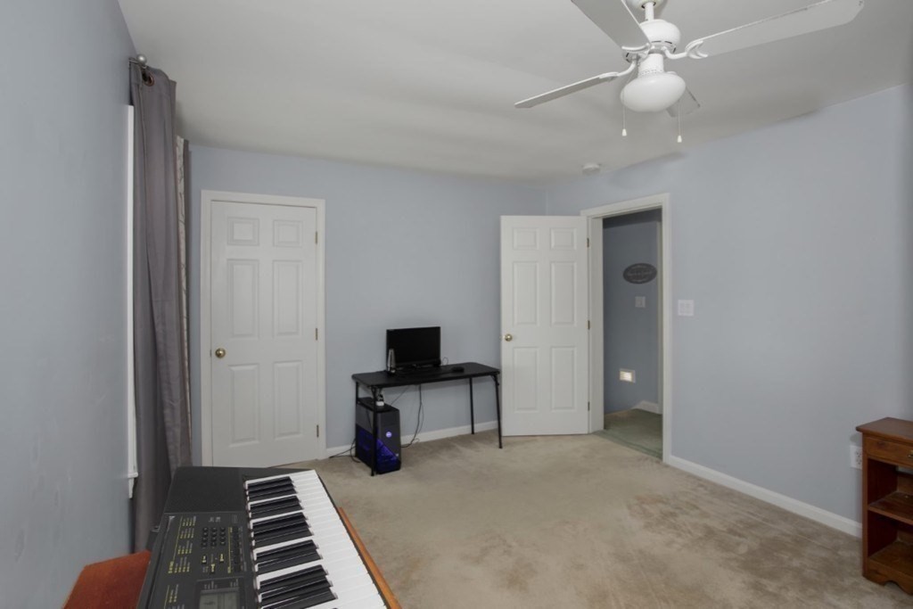 3 Bancroft Avenue, Unit 3 Reading, MA 01867 - Photo 16 of 19 a view of a room with wooden floor and white walls