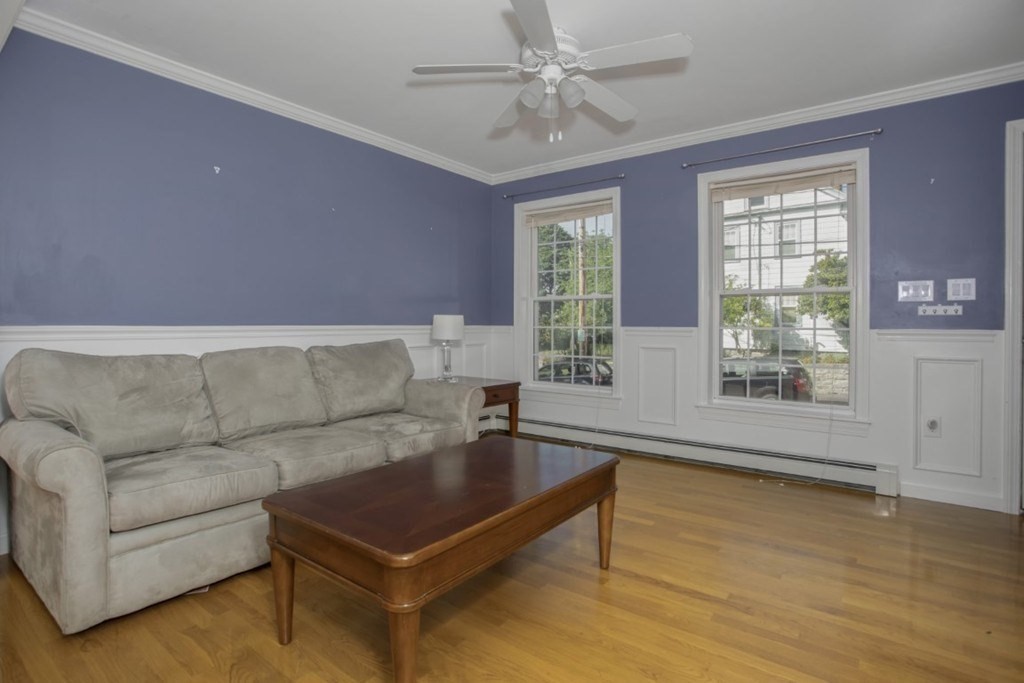 3 Bancroft Avenue, Unit 3 Reading, MA 01867 - Photo 3 of 19 a living room with furniture and a large window