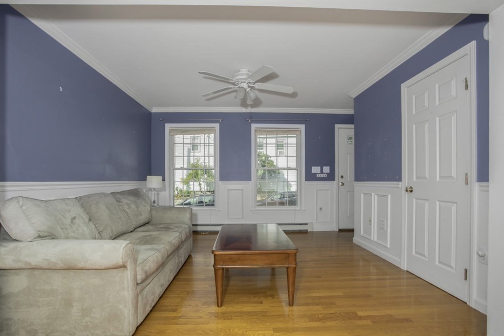 3 Bancroft Avenue, Unit 3 Reading, MA 01867 - Photo 4 of 19 a living room with furniture and wooden floor