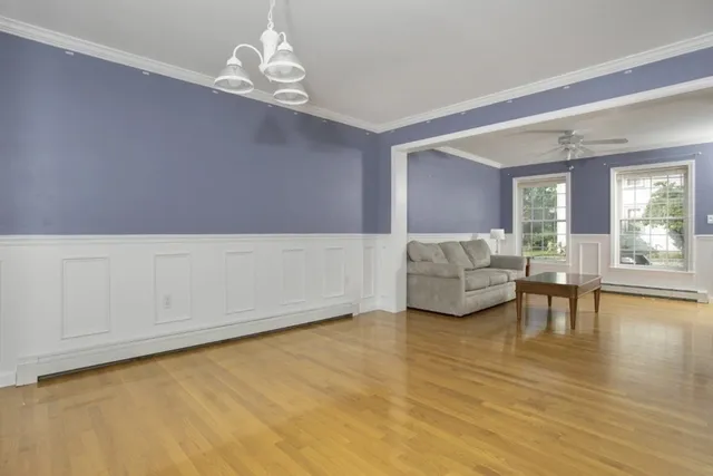 a living room with furniture and a table