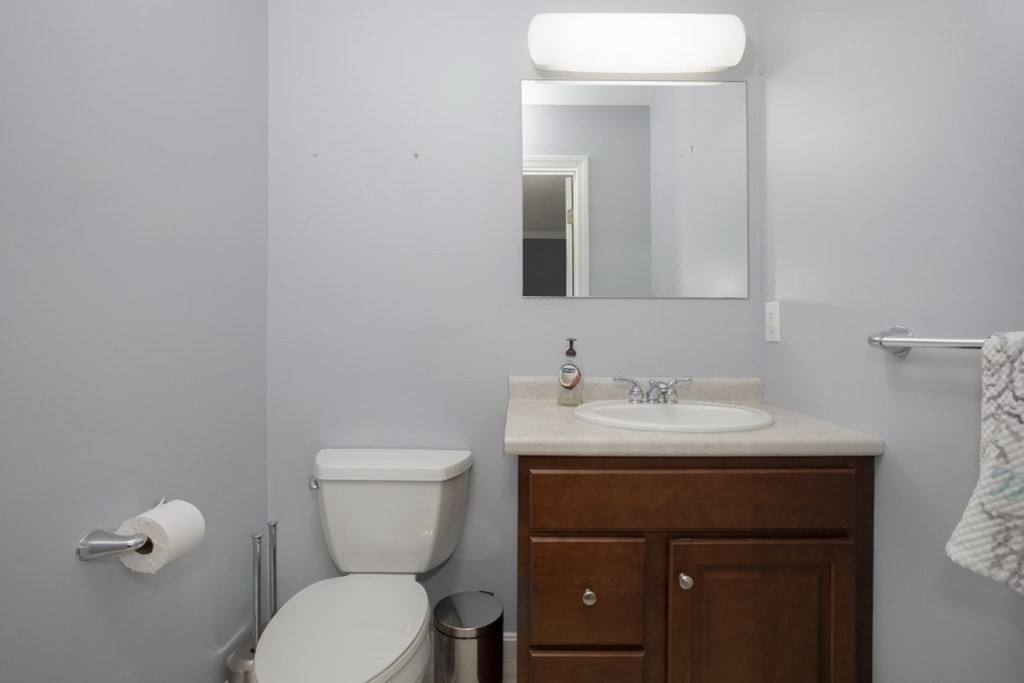 3 Bancroft Avenue, Unit 3 Reading, MA 01867 - Photo 10 of 19 a bathroom with a toilet sink and mirror