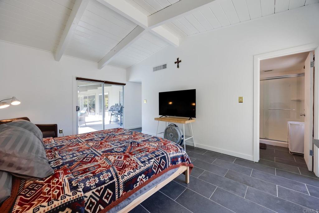 255 Montezuma Road Borrego Springs, CA 92004 - Photo 15 of 26 a bedroom with a bed and a television